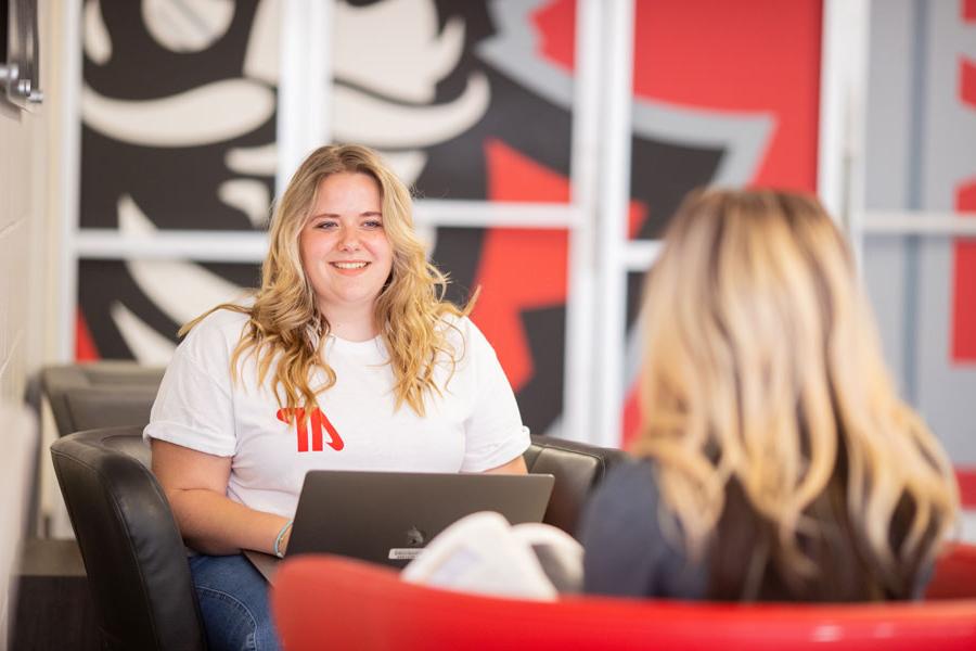 two students talking to each other