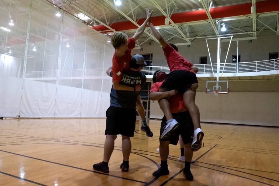 students on Foy Gym Court celebrating intramural win